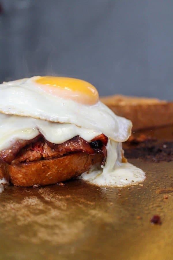 Fuwamai open-face sando with grilled steak, melted cheese, and fried egg on toasted shokupan