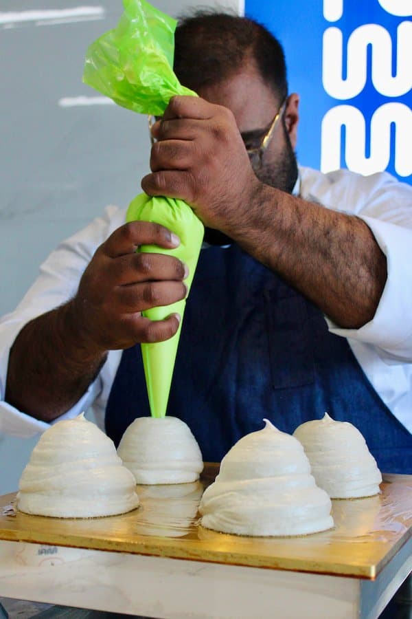 Fuwamai chef piping whipped cream onto Japanese soufflé pancakes at the St Julian's Malta bakery