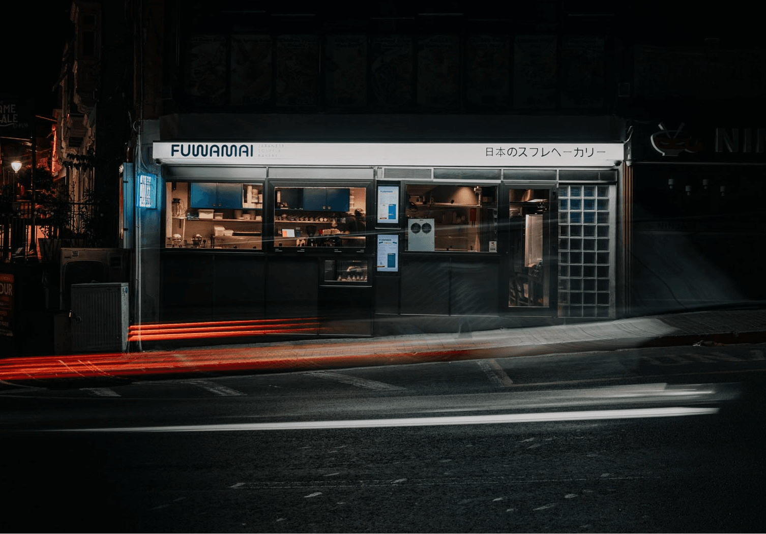 Fuwamai Japanese soufflé bakery storefront at night in St Julian's Malta with Japanese signage