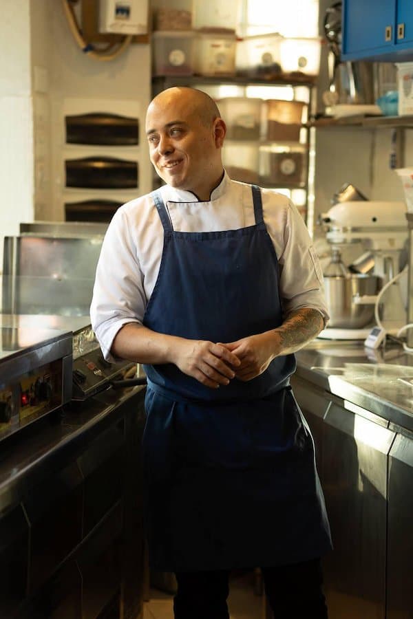 Santiago Javier, Fuwamai Head Chef, standing in the Fuwamai kitchen